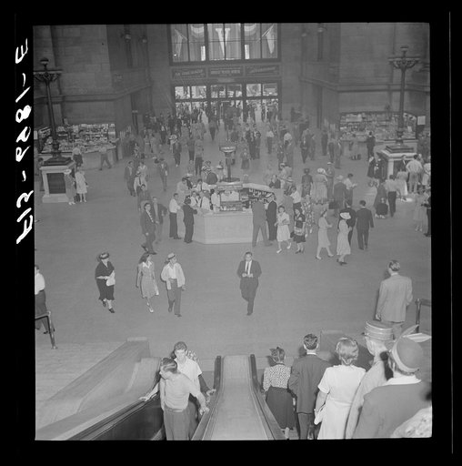 Untitled photo, possibly related to: New York, New York. Information booth and escalators at the Pennsylvania railroad station