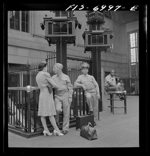 New York, New York. Waiting for trains at the Pennsylvania railroad station