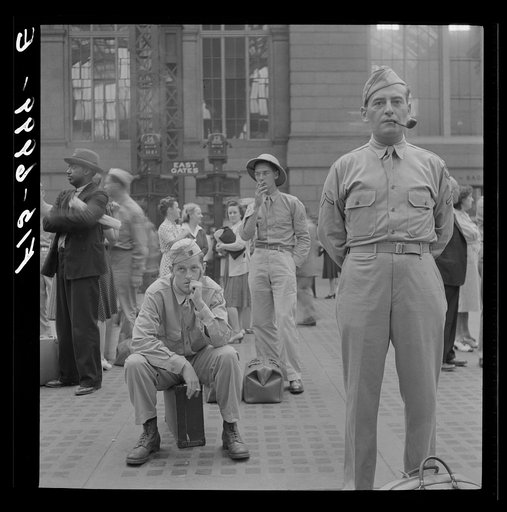 New York, New York. Waiting for trains at the Pennsylvania railroad station
