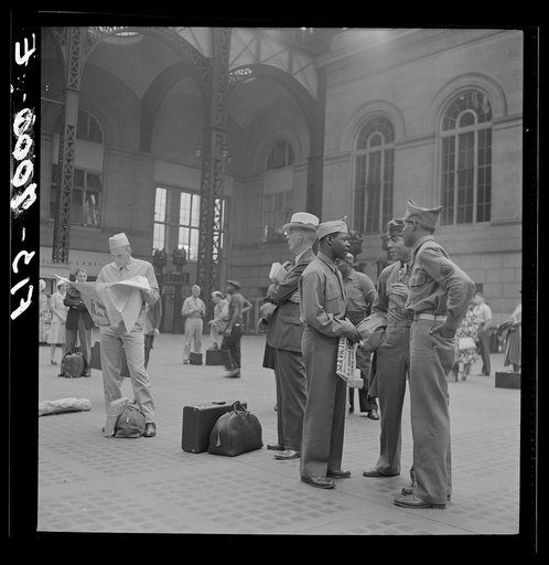 New York, New York. Waiting for the trains at the Pennsylvania railroad station
