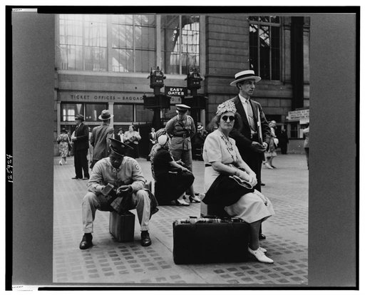 New York, New York. Waiting for the trains at the Pennsylvania railroad station