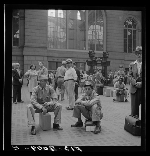New York, New York. Waiting for the trains at the Pennsylvania railroad station