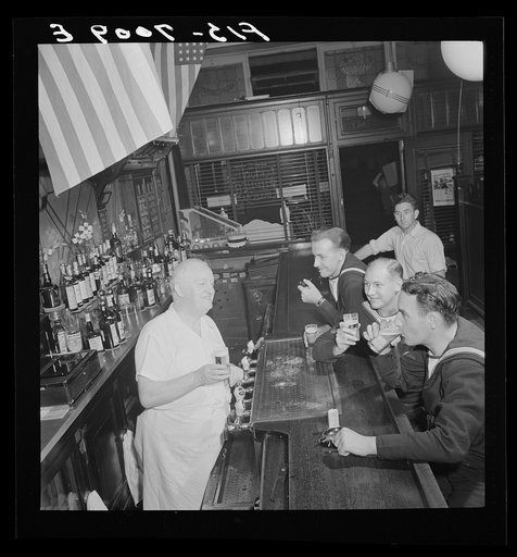 Untitled photo, possibly related to: New York, New York. Irish-American bartender serving beer to British sailors in a Third Avenue bar in the "Forties"