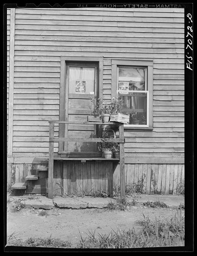 Detroit, Michigan. Sign in a window indicating number of men in the armed forces