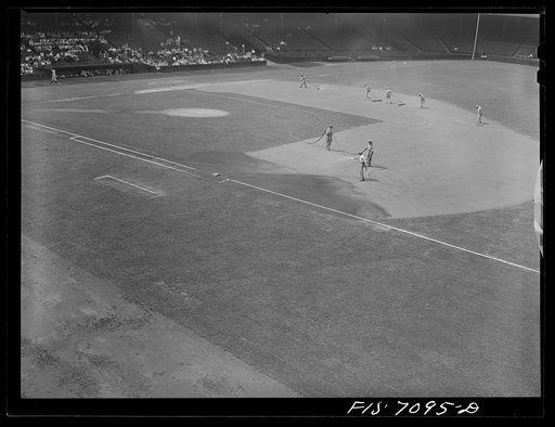 Detroit, Michigan. Preparing the field before the start of the ball game at Briggs Stadium