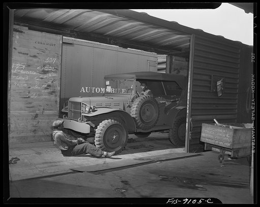 Chrysler Corporation. Dodge truck plant. Detroit, Michigan (vicinity). Loading a Dodge Army truck onto a freight car