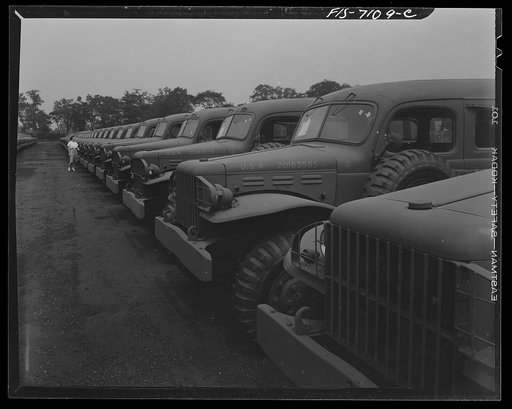 Untitled photo, possibly related to: Chrysler Corporation. Dodge truck plant. Detroit, Michigan (vicinity). Some of the thousands of Dodge Army ambulances lined up for delivery to the Army