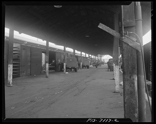 Untitled photo, possibly related to: Chrysler Corporation. Dodge truck plant. Detroit, Michigan (vicinity). Loading Dodge Army trucks on freight cars