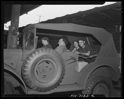 Untitled photo, possibly related to: Dodge truck plant, Detroit, Michigan. Workers eating lunch on uncushioned seats of a half-finished command reconnaissance car