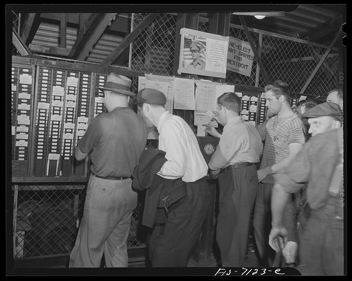 Detroit, Michigan (vicinity). Chrysler Corportation Dodge truck plant. War workers "punching in" for their job of helping to "punch" the axis