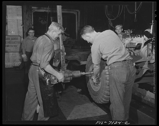 Detroit, Michigan (vicinity). Chrysler Corportation Dodge truck plant. Wheels are quickly bolted to Dodge Army trucks by automatic wrenches