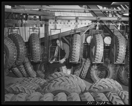 Detroit, Michigan (vicinity). Chrysler corportation Dodge truck plant. These tires are for Dodge Army trucks. Overhead conveyors quickly move them from receiving docks to their proper places along the vast production line