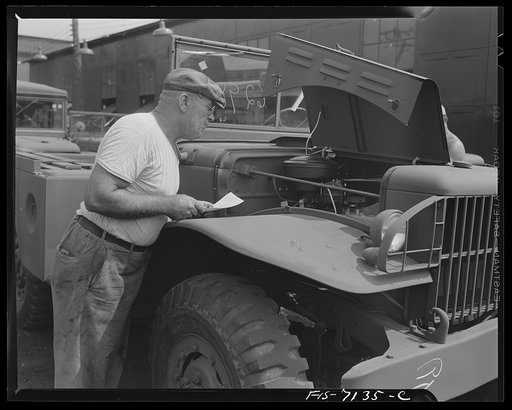 Detroit, Michigan (vicinity). Chrysler Corporation Dodge truck plant. A sharp-eyed inspector checks engine accessories of a Dodge Army truck which is ready for shipment