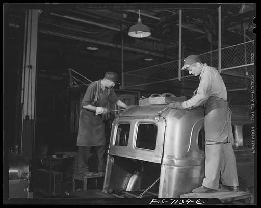 Detroit, Michigan (vicinity). Chrysler Corporation Dodge truck plant. Preparing the cab of a Dodge Army truck for paint and final finish