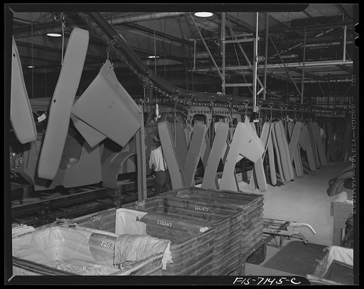 Detroit, Michigan (vicinity). Chrysler Corporation Dodge truck plant. Long columns of sheet metal parts: hoods, bumpers, fenders proceed on the conveyor to their appointed places on the Army truck production line