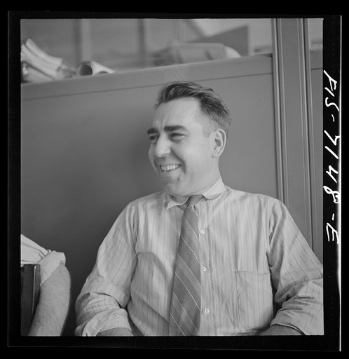 Detroit, Michigan (vicinity). Chrysler Corporation Dodge truck plant. He stopped just long enough to pose for his picture, but immediately afterward, this war worker returned to his job of helping to build Dodge Army trucks