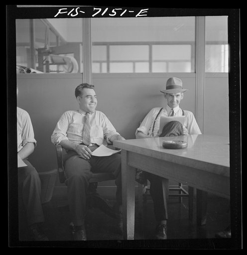 Untitled photo, possibly related to: Detroit, Michigan (vicinity). Chrysler Corporation Dodge truck plant. Many conferences over production schedules, blue prints, etc. are required to maintain the smooth, steady flow of Dodge Army trucks from the production lines