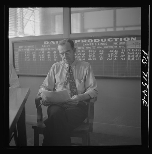 Detroit, Michigan (vicinity). Chrysler Corporation Dodge truck plant. Production supervisor discussing daily production at production meeting