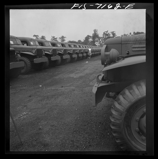 Untitled photo, possibly related to: Detroit, Michigan (vicinity). Chrysler Corporation Dodge truck plant. Dodge Army vehicles are lined up to be driven away for service with various branches of the armed forces