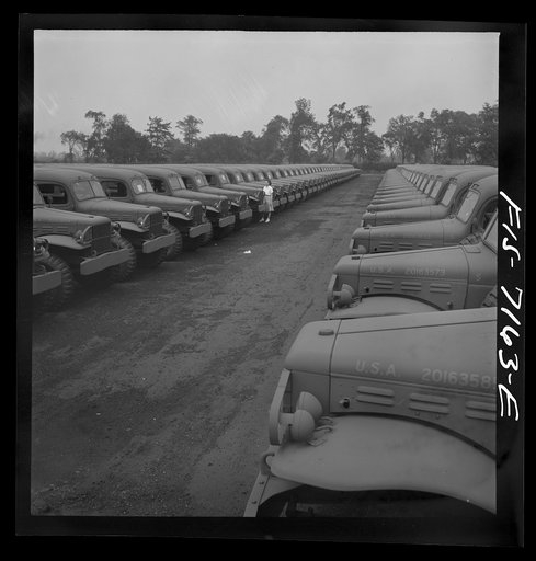 Untitled photo, possibly related to: Detroit, Michigan (vicinity). Chrysler Corporation Dodge truck plant. Dodge Army vehicles are lined up to be driven away for service with various branches of the armed forces