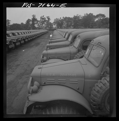 Untitled photo, possibly related to: Detroit, Michigan (vicinity). Chrysler Corporation Dodge truck plant. Dodge Army vehicles are lined up to be driven away for service with various branches of the armed forces