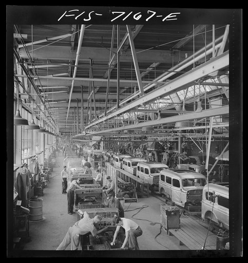 Untitled photo, possibly related to: Detroit, Michigan (vicinity). Chrysler Corporation Dodge truck plant. A steady stream of bodies for Dodge Army trucks receive important finishing operations along this section of the production line