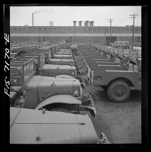 Detroit, Michigan (vicinity). Chrysler Corporation Dodge truck plant. Side by side and end to end of Dodge Army trucks, produced daily, stand in the yards waiting for the final touches that make them effective fighting vehicles