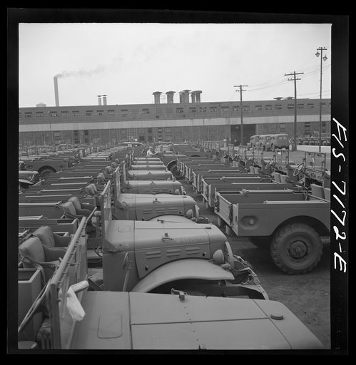 Untitled photo, possibly related to: Detroit, Michigan (vicinity). Chrysler Corporation Dodge truck plant. Side by side and end to end of Dodge Army trucks, produced daily, stand in the yards waiting for the final touches that make them effective fighting vehicles