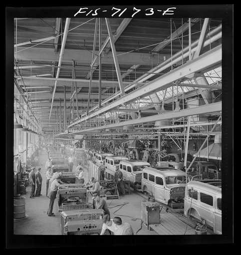 Untitled photo, possibly related to: Detroit, Michigan (vicinity). Chrysler Corporation Dodge truck plant. A steady stream of bodies for Dodge Army trucks receive important finishing operations along this section of the production line