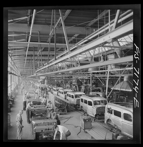 Untitled photo, possibly related to: Detroit, Michigan (vicinity). Chrysler Corporation Dodge truck plant. A steady stream of bodies for Dodge Army trucks receive important finishing operations along this section of the production line