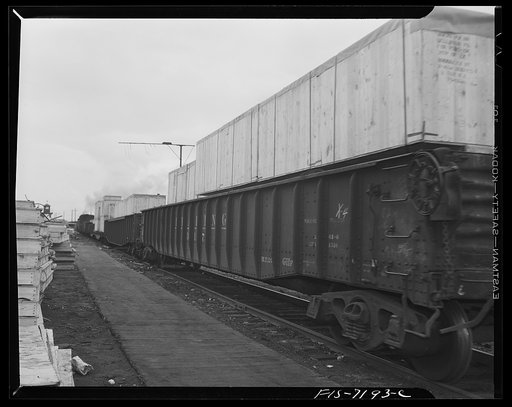 Untitled photo, possibly related to: Detroit, Michigan (vicinity). Chrysler Corporation Dodge truck plant. Loaded freight cars leaving the plant