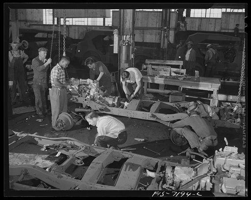 Dodge truck plant, Detroit, Michigan. Taking apart a Dodge truck after all testing has been completed to pack into crates for export shipment