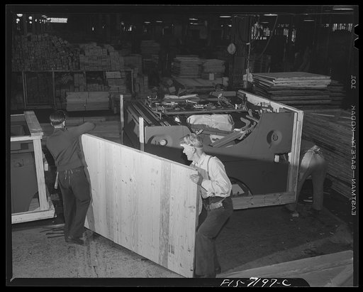 Dodge truck plant, Detroit, Michigan. Side of crate being put on package for export shipment. This crate holds an entire truck, knocked down