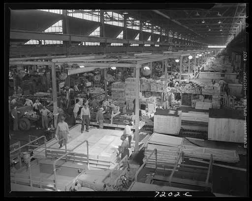 Detroit, Michigan (vicinity). Chrysler Corporation Dodge truck plant. Interior of export plant showing huge quantities of lumber required to crate trucks