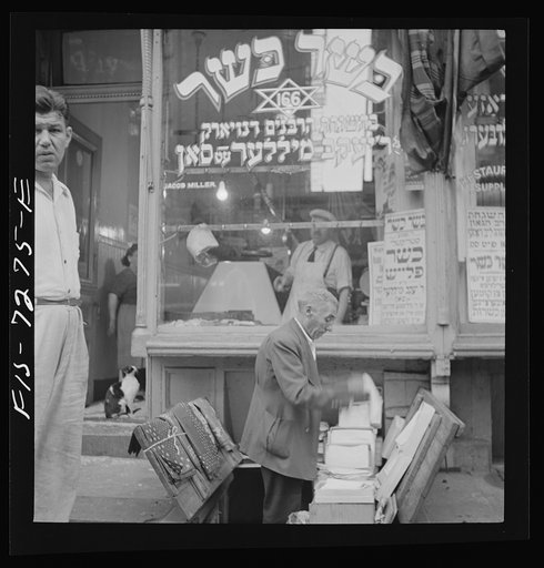 New York, New York. Sidewalk merchant in the Jewish section