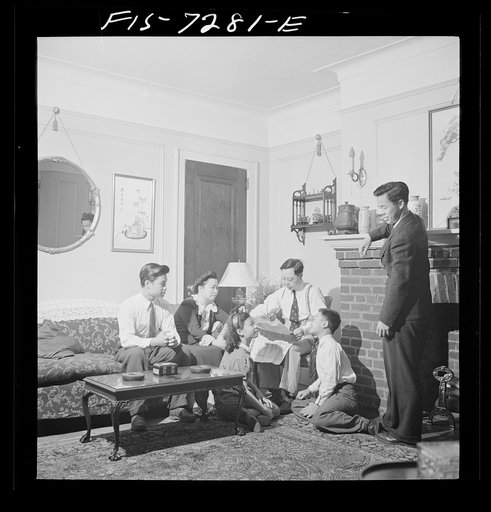 Untitled photo, possibly related to: New York, New York. Mr. Fing, a Chinese-American merchant, and his wife in their Flatbush home. Notice the rubber tire ashtrays