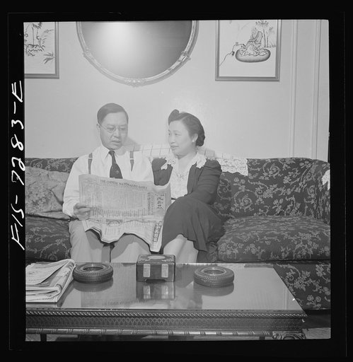 Untitled photo, possibly related to: New York, New York. Mr. Fing, a Chinese-American merchant, and his wife in their Flatbush home. Notice the rubber tire ashtrays