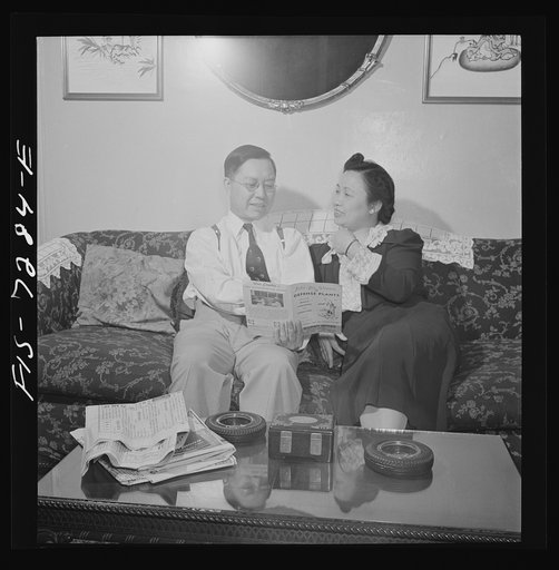 New York, New York. Mr. Fing, a Chinese-American merchant, and his wife in their Flatbush home. Notice the rubber tire ashtrays
