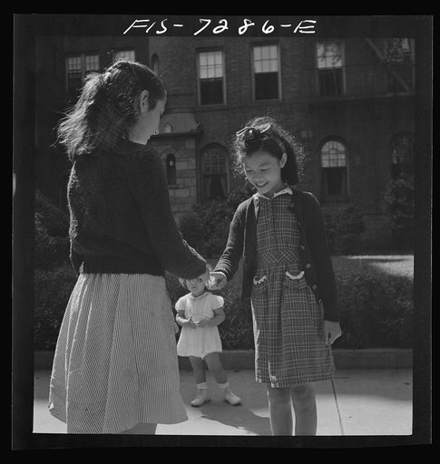 Untitled photo, possibly related to: New York, New York. Chinese-American girl playing hopscotch with American friends outside her home in Flatbush