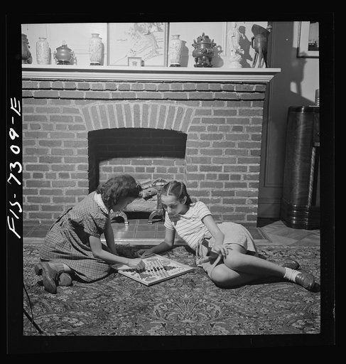 Untitled photo, possibly related to: New York, New York. Chinese-American playing Chinese checkers with a Jewish friend in his Flatbush home