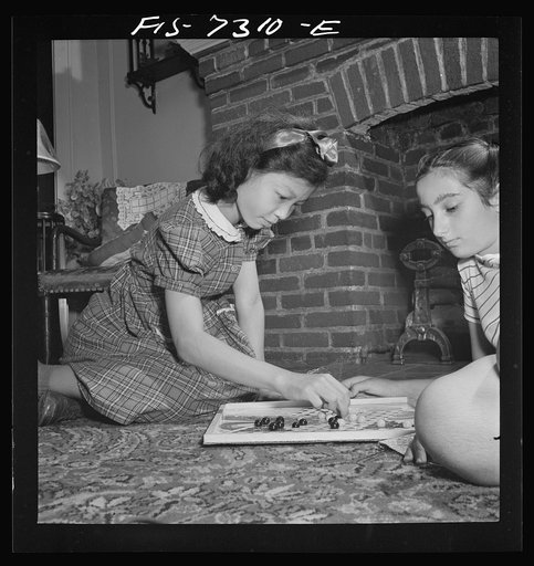 Untitled photo, possibly related to: New York, New York. Chinese-American playing Chinese checkers with a Jewish friend in his Flatbush home