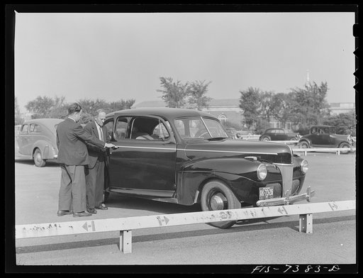 Dearborn, Michigan. Karl Axel Westerberg and his son, Eric, leaving the plant of the Ford Motor Company where his son is employed as an expert tool and die maker and he is foreman of the rough stock department of the Johansson gauge division. They drive twenty-five miles to and from work in their Fo