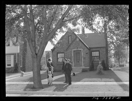 Dearborn, Michigan. Outside the pleasant brick home of Mrs. Ruth Peterson, the daugter of Karl Axel Westerberg. Her husband is employed as an expert tool and die maker at the Ford Motor Company. She and their two children are shown with her brother Eric and her father