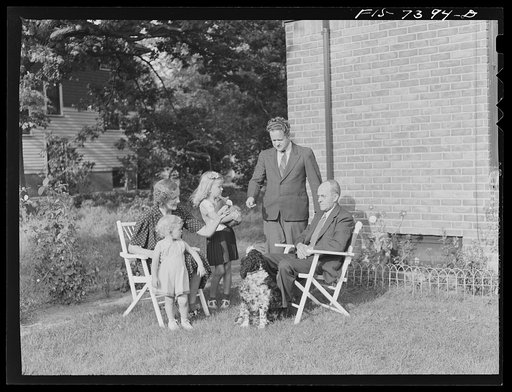 Dearborn, Michigan. Mrs. Peterson, daughter of Karl Axel Westerberg, and her two children, Joyce and Evelyn, with Eric Westerberg her brother outside the Peterson home
