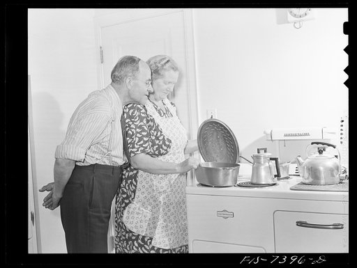 Cass Lake, near Pontiac, Michigan. Mr. Westerberg inspecting Mrs. Westerberg's dinner preparation of Swedish dishes. The Westerbergs came from Eskilstuna, Sweden in 1924