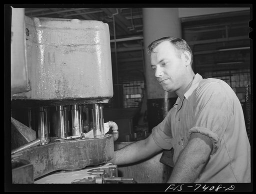 Detroit, Michigan. Drill press operator at the Allison Motors plant