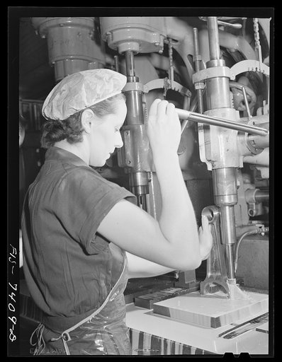 Detroit, Michigan. Drill press operator at the Allison Motors plant