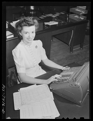 Detroit, Michigan. Office worker at the Allison Motors plant