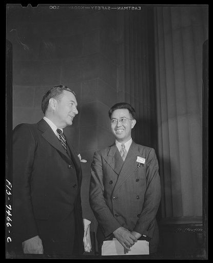 Washington, D.C. International student assembly. Dr. Hu Shih, Chinese ambassador, talking with Miss Shih-Yung Wang in the reception room of the Chinese embassy