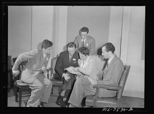 Washington, D.C. Foreign students at the international student sssembly recording short talks in their native language to be broadcast by shortwave, after censorship by the Office of War Information (OWI), to Nazi-held territory. An Italian group discussing the wording of their speeches
